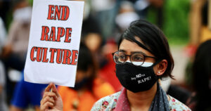 A feminist group take part in an ongoing protest demanding justice for the alleged gang rape of a woman