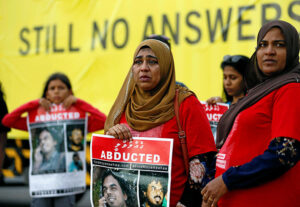 Family members of disappeared Maldivian journalist Ahmed Rilwan Abdulla participate in an event to mark the "International Day of the Disappeared" in Colombo